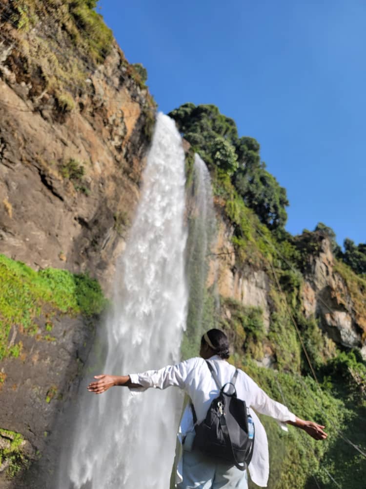 Chebokoch Waterfall with lush plantations and serene swimming pool