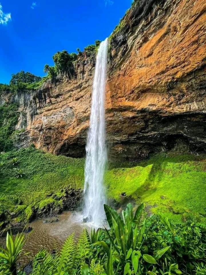 Kaptogolo Waterfall with ancient rock paintings and mineral deposits